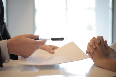 a person signing a contract