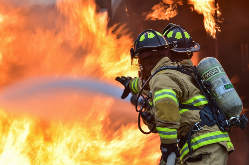 firefighters with a hose