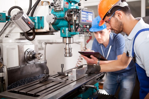 two workers testing some specialized equpiment